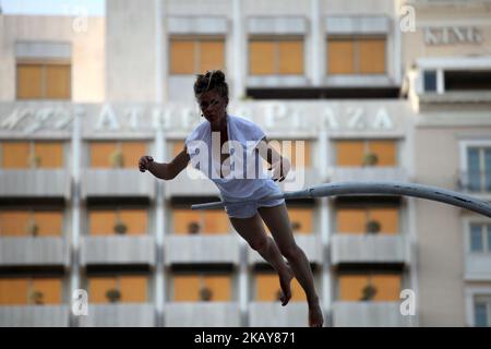 French performer Chloe Moglia delivers a breathtaking acrobatic performance at Syntagma square in Athens, Greece on June 7, 2018 as part of the Athens Epidaurus Festival 2018. (Photo by Giorgos Georgiou/NurPhoto) Stock Photo