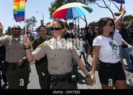 Los Angeles County Sheriff's Department deputies march in the LA Pride Parade in West Hollywood, California on June 10, 2018. The annual LGBTQ celebration drew an estimated crowd of 150,000 people. (Photo by Ronen Tivony/NurPhoto) Stock Photo