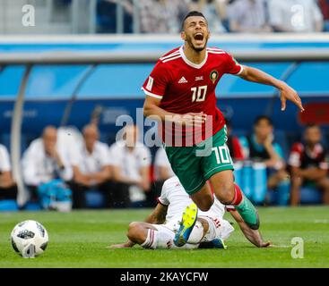 Younes Belhanda (R) of Morocco national team and Vahid Amiri of IR Iran national team vie for the ball during the 2018 FIFA World Cup Russia Group B match between Morocco and IR Iran on June 15, 2018 at Saint Petersburg Stadium in Saint Petersburg, Russia. (Photo by Mike Kireev/NurPhoto) Stock Photo