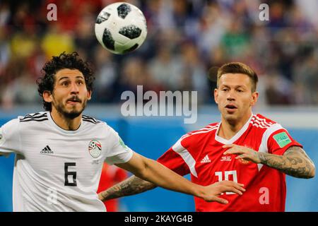 Fedor Smolov (R) of Russia national team and Ahmed Hegazy of Egypt national team vie for the ball during the 2018 FIFA World Cup Russia group A match between Russia and Egypt on June 19, 2018 at Saint Petersburg Stadium in Saint Petersburg, Russia. (Photo by Mike Kireev/NurPhoto) Stock Photo