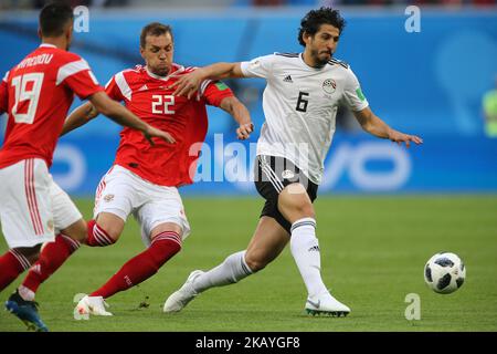 Artem Dzyuba (L) of the Russia national football team and Ahmed Hegazy of the Egypt national football team vie for the ball during the 2018 FIFA World Cup match, first stage - Group A between Russia and Egypt at Saint Petersburg Stadium on June 19, 2018 in St. Petersburg, Russia. (Photo by Igor Russak/NurPhoto) Stock Photo