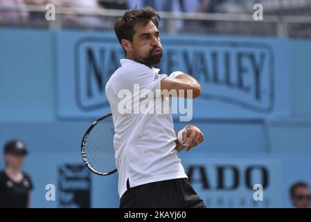Jeremy Chardy of France returns during the semi final singles match on day six of Fever Tree Championships at Queen's Club in London, UK on June 23, 2018. (Photo by Alberto Pezzali/NurPhoto) Stock Photo