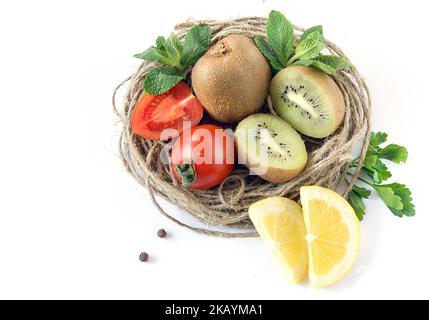 Composition of fruits and vegetables with wicker craft basket. Stock Photo