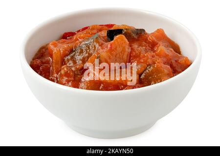 Ratatouille in white ceramic bowl isolated on white. Stock Photo
