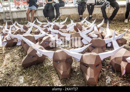 Paperboard bullhead mask during the preparations of a protest against the animal cruelty in bullfightings before the San Fermin celebrations in Pamplona, Spain. (Photo by Celestino Arce/NurPhoto) Stock Photo