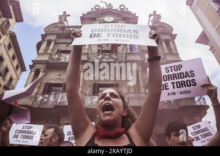 Protester against animal cruelty in bull fightings before San Fermin celebrations shouts under the Pamplona city council building, Spain. (Photo by Celestino Arce/NurPhoto) Stock Photo