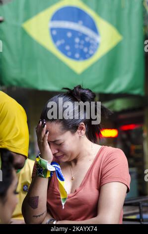 Fans react to the quarterfinals match of the 2018 World Cup between Brazil and Belgium, in downtown Sao Paulo, Brazil. Belgium won by 2-1, leaving millions of brazilians hopeless across the country (Photo by Gustavo Basso/NurPhoto) Stock Photo