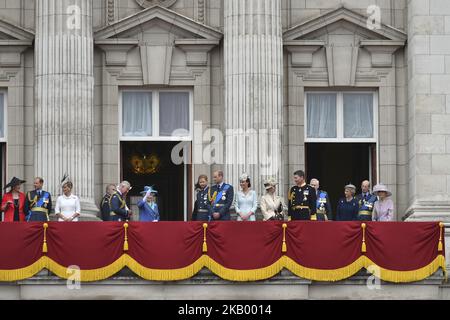 (L-R) Prince and Princess Michael of Kent, Prince Edward, Earl of Wessex, Sophie, Countess of Wessex, Prince Charles, Prince of Wales, Prince Andrew, Duke of York, Camilla, Duchess of Cornwall, Queen Elizabeth II, Meghan, Duchess of Sussex, Prince Harry, Duke of Sussex, Prince William, Duke of Cambridge, Catherine, Duchess of Cambridge, Anne, Princess Royal, Vice Admiral Sir Timothy Laurence, Prince Richard, Duke of Gloucester, Birgitte, Duchess of Gloucester, Prince Edward, Duke of Kent and Katharine, Duchess of Kent watch the RAF flypast on the balcony of Buckingham Palace, as members of the Stock Photo