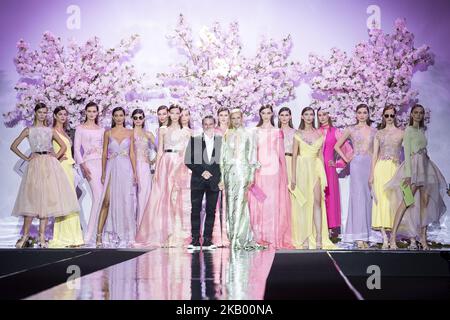 Model Judith Masco and designer Hannibal Laguna walks the runway at the 'Hannibal Laguna' catwalk during the Mercedes-Benz Madrid Fashion Week Spring/Summer in Madrid, Spain. July 10, 2018. (Photo by Peter Sabok/NurPhoto) Stock Photo