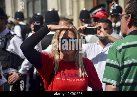 Pro Trump demonstrators gather at Parliament Square as a protest takes place in Central London, against the US President Donald Trumps visit to the UK, including a giant inflatable Baby Trump, London on July 13, 2018. The President of the United States and First Lady, Melania Trump, visited Prime Minister Theresa May at Chequers and take tea with the Queen at Windsor Castle. (Photo by Alberto Pezzali/NurPhoto) Stock Photo
