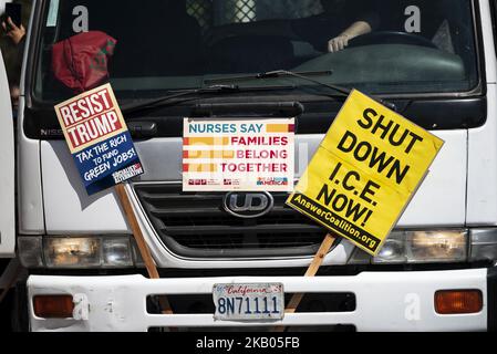 Anti-Trump and ICE signs seen during Families Belong Together March in Los Angeles, California on July 21, 2018. Protesters demanded the reunification of detained migrant children with their parents and organizers of the Families Belong Together March called to abolish ICE. (Photo by Ronen Tivony/NurPhoto) Stock Photo