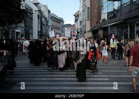 Thousands of people protest in Aarhus, Denmark, on August 1, 2018 in defiance of the Danish Governments ban on the burka and niqab. The nationwide protests were organized by the Socialist Youth Front and two organizations named Women in Dialogue and Party Rebels. (Photo by Aleksander Klug/NurPhoto) Stock Photo