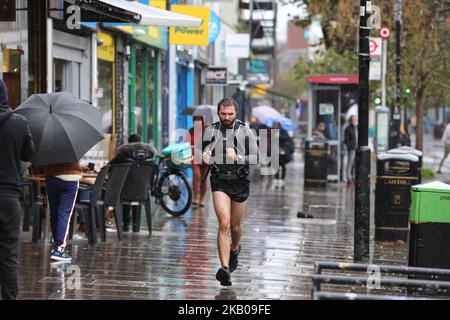 London, UK. 30th Oct, 2022. A runner jogging during rainfall in London. According to The Met Office rain is expected in many parts of the country this week. (Credit Image: © Dinendra Haria/SOPA Images via ZUMA Press Wire) Stock Photo