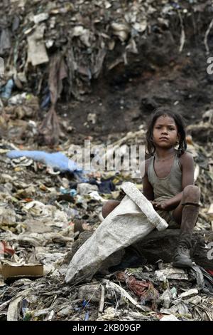 A child ragpicker at one of the largest disposal sites in the north ...