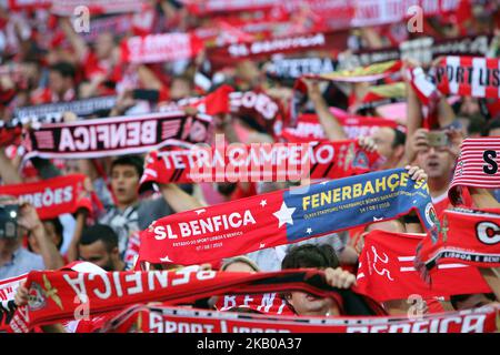 Benfica's supporters wave their scarves during the UEFA Champions League 3rd Qualifying Round first leg match Benfica vs Fenerbahce at the Luz Stadium in Lisbon, Portugal on August 7, 2018. ( Photo by Pedro FiÃºza/NurPhoto) Stock Photo