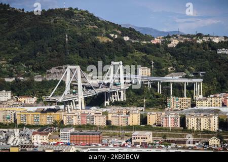 A general view of the Morandi bridge which collapsed on August 14, 2018 in Genoa, Italy. At at least 22 people have died when a large section of Morandi bridge built in the 1960s and part of the A10 motorway suddenly collapsed during a fierce storm sending vehicles falling up to 90m to the ground. (Photo by Fabio Palli/NurPhoto) Stock Photo