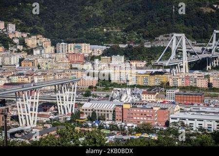 A general view of the Morandi bridge which collapsed on August 14, 2018 in Genoa, Italy. At at least 22 people have died when a large section of Morandi bridge built in the 1960s and part of the A10 motorway suddenly collapsed during a fierce storm sending vehicles falling up to 90m to the ground. (Photo by Fabio Palli/NurPhoto) Stock Photo