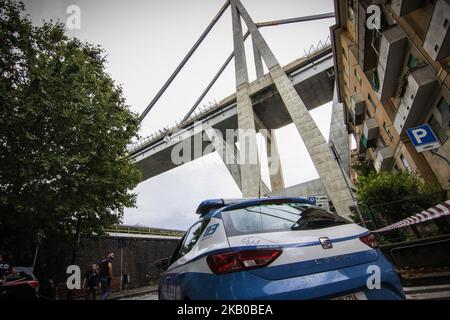 A general view of the Morandi bridge which collapsed on August 14, 2018 in Genoa, Italy. At at least 22 people have died when a large section of Morandi bridge built in the 1960s and part of the A10 motorway suddenly collapsed during a fierce storm sending vehicles falling up to 90m to the ground. (Photo by Fabio Palli/NurPhoto) Stock Photo