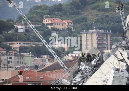The remains of the Morandi motorway bridge stands after it partially collapsed in Genoa, Italy, on Tuesday, Aug. 14, 2018. The famous bridge of highway A10 that connected the Liguria region with south Italy collapsed with many victims. (Photo by Mauro Ujetto/NurPhoto) Stock Photo