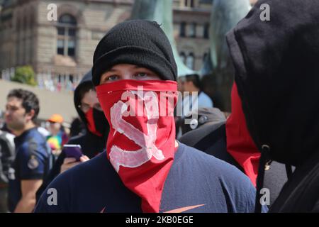 Members of the Revolutionary Communist Party of Canada take part in a counter-protest against white supremacy groups in Toronto, Ontario, Canada, on August 11, 2018. Protesters clashed with police who were deployed to protect members of a white supremacy group rallying outside Toronto City Hall. (Photo by Creative Touch Imaging Ltd./NurPhoto) Stock Photo