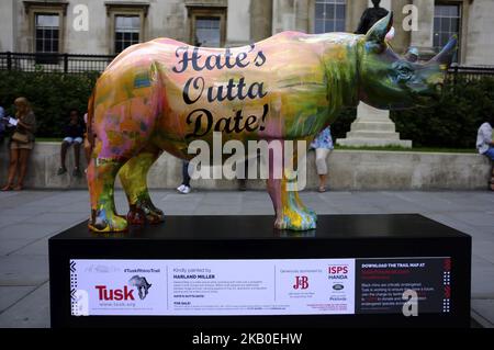 A 300kg rhino sculpture painted by Harland Miller is pictured in London on August 22, 2018. The sculpture hits the streets as part of the Tusk Rhino Trail in London, a City-wide installation to raise funds for the protection of rhinos in Africa. (Photo by Alberto Pezzali/NurPhoto) Stock Photo