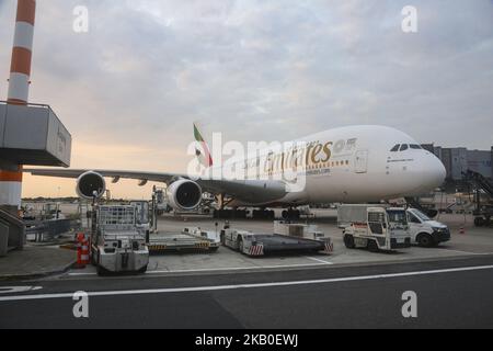 Emirates Airbus A380 docked at Dusseldorf Airport in Germany on August 21, 2018. The double-decker airplane as seen during the golden hour in Dusseldorf airport. Emirates operates 2 daily flights with A380 from Dubai International DXB airport, UAE to Dusseldorf International, DUS airport, Germany, flights EK55 and return to Dubai EK 56 and EK57 and return EK 58. Emirates is the largest Airbus A380-800 operator with a fleet of 104 airplanes and 58 more in order. (Photo by Nicolas Economou/NurPhoto) Stock Photo