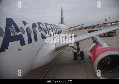 Air Serbia as seen on August 21 2018 in Belgrade, Serbia, the flag carrier of the country. The airline operates a 21 aircraft fleet from the main hub Nikola Tesla International Airport in Belgrade, Serbia. The airline is owned by the Government of Serbia and Etihad Airways as Etihad acquired a 49% stake in Jat Airways, the former name of Air Serbia. The airline owns a subsidiary airline called Aviolet. Today's fleet consists of 21 aircrafts and an order of 10 new Airbus A320neo. Currently, they serve 8 Airbus A319, 2 Airbus A320, 3 ATR 72-200, 3 ATR 72-500, 4 Boeing 737-300 and one wide body  Stock Photo