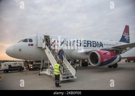 Air Serbia as seen on August 21 2018 in Belgrade, Serbia, the flag carrier of the country. The airline operates a 21 aircraft fleet from the main hub Nikola Tesla International Airport in Belgrade, Serbia. The airline is owned by the Government of Serbia and Etihad Airways as Etihad acquired a 49% stake in Jat Airways, the former name of Air Serbia. The airline owns a subsidiary airline called Aviolet. Today's fleet consists of 21 aircrafts and an order of 10 new Airbus A320neo. Currently, they serve 8 Airbus A319, 2 Airbus A320, 3 ATR 72-200, 3 ATR 72-500, 4 Boeing 737-300 and one wide body  Stock Photo