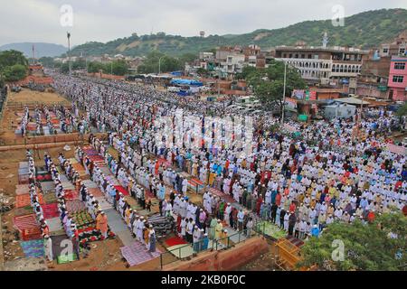 An Indian Muslims offer prayer 'Namaz' at Idgah Mosque in Jaipur-Delhi National Highway-8 on the occasion of Eid-al-Adha, in Jaipur, Rajasthan, India, August 22, 2018. Muslims around the world are celebrating Eid al-Adha or the Festival of Sacrifice, the second biggest Muslim religious festival. Muslims celebrate Eid al-Adha by slaughtering bovine animals, livestock including camels, sheep, goats and cows to pay tribute to the prophet Abraham's devotion to Allah (Lord). According to religious scriptures Abraham was ready to sacrifice his son, the Prophet Ismael, on the order of Allah (Lord) wh Stock Photo