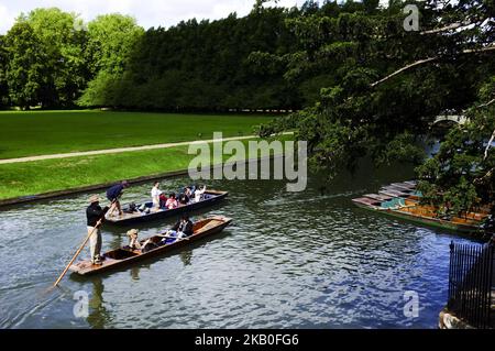 Boats on the river Cam are pictured in Cambridge, on August 25, 2018. Cambridge is home to the world-renowned University of Cambridge, which was founded in 1209. The university includes King's College Chapel, Cavendish Laboratory, and the Cambridge University Library, one of the largest legal deposit libraries in the world. The city's skyline is dominated by several college buildings, along with the spire of the Our Lady and the English Martyrs Church, the chimney of Addenbrooke's Hospital and St John's College Chapel tower. Anglia Ruskin University, evolved from the Cambridge School of Art an Stock Photo