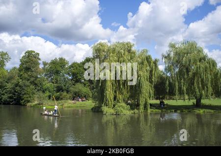 Boats on the river Cam are pictured in Cambridge, on August 25, 2018. Cambridge is home to the world-renowned University of Cambridge, which was founded in 1209. The university includes King's College Chapel, Cavendish Laboratory, and the Cambridge University Library, one of the largest legal deposit libraries in the world. The city's skyline is dominated by several college buildings, along with the spire of the Our Lady and the English Martyrs Church, the chimney of Addenbrooke's Hospital and St John's College Chapel tower. Anglia Ruskin University, evolved from the Cambridge School of Art an Stock Photo