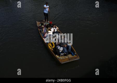 Boats on the river Cam are pictured in Cambridge, on August 25, 2018. Cambridge is home to the world-renowned University of Cambridge, which was founded in 1209. The university includes King's College Chapel, Cavendish Laboratory, and the Cambridge University Library, one of the largest legal deposit libraries in the world. The city's skyline is dominated by several college buildings, along with the spire of the Our Lady and the English Martyrs Church, the chimney of Addenbrooke's Hospital and St John's College Chapel tower. Anglia Ruskin University, evolved from the Cambridge School of Art an Stock Photo