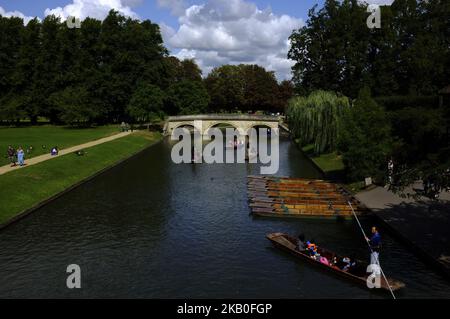 Boats on the river Cam are pictured in Cambridge, on August 25, 2018. Cambridge is home to the world-renowned University of Cambridge, which was founded in 1209. The university includes King's College Chapel, Cavendish Laboratory, and the Cambridge University Library, one of the largest legal deposit libraries in the world. The city's skyline is dominated by several college buildings, along with the spire of the Our Lady and the English Martyrs Church, the chimney of Addenbrooke's Hospital and St John's College Chapel tower. Anglia Ruskin University, evolved from the Cambridge School of Art an Stock Photo