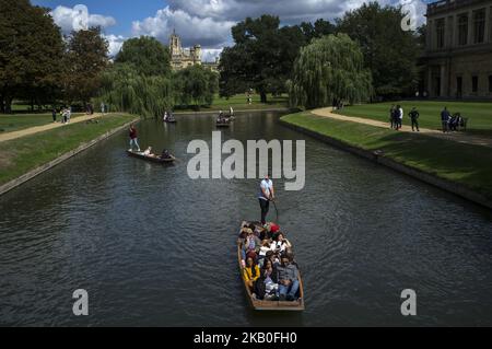 Boats on the river Cam are pictured in Cambridge, on August 25, 2018. Cambridge is home to the world-renowned University of Cambridge, which was founded in 1209. The university includes King's College Chapel, Cavendish Laboratory, and the Cambridge University Library, one of the largest legal deposit libraries in the world. The city's skyline is dominated by several college buildings, along with the spire of the Our Lady and the English Martyrs Church, the chimney of Addenbrooke's Hospital and St John's College Chapel tower. Anglia Ruskin University, evolved from the Cambridge School of Art an Stock Photo