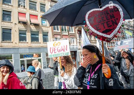 People take part in Animal rights march in Amsterdam, Netherlands, on August 25, 2018. Thousands of animal lovers gathered around the Dam square in Amsterdam to stand up and speak out against all forms in which animals are used, abused and exploited. (Photo by Romy Arroyo Fernandez/NurPhoto) Stock Photo