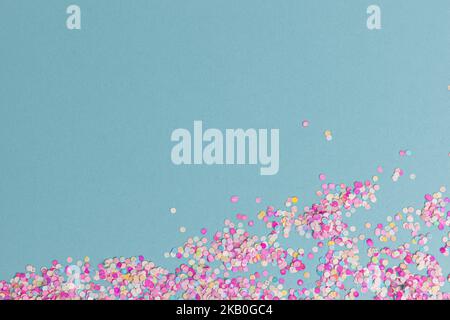 creative festive frame with colors dots party on blue pastel background, top view Stock Photo