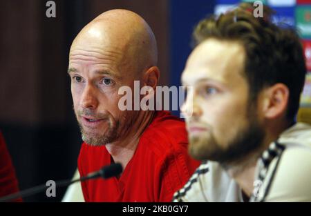 Ajax head coach Erik ten Hag (L) and Ajax's player Daley Blind (R) attend a press conference in Kiev, Ukraine, 27 August,2018. Ajax Amsterdam will play against FC Dynamo Kyiv at the UEFA Champions League play off, second leg, soccer match on August 28. (Photo by STR/NurPhoto) Stock Photo