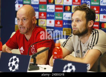 Ajax head coach Erik ten Hag (L) and Ajax's player Daley Blind (R) attend a press conference in Kiev, Ukraine, 27 August,2018. Ajax Amsterdam will play against FC Dynamo Kyiv at the UEFA Champions League play off, second leg, soccer match on August 28. (Photo by STR/NurPhoto) Stock Photo