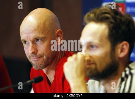 Ajax head coach Erik ten Hag (L) and Ajax's player Daley Blind (R) attend a press conference in Kiev, Ukraine, 27 August,2018. Ajax Amsterdam will play against FC Dynamo Kyiv at the UEFA Champions League play off, second leg, soccer match on August 28. (Photo by STR/NurPhoto) Stock Photo