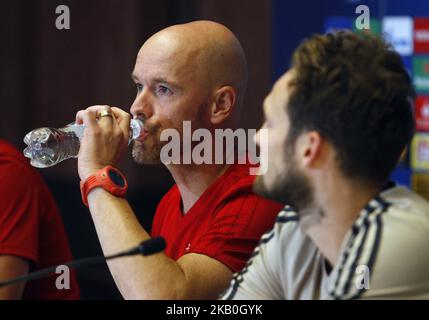 Ajax head coach Erik ten Hag (L) and Ajax's player Daley Blind (R) attend a press conference in Kiev, Ukraine, 27 August,2018. Ajax Amsterdam will play against FC Dynamo Kyiv at the UEFA Champions League play off, second leg, soccer match on August 28. (Photo by STR/NurPhoto) Stock Photo