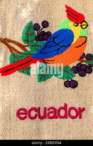 Hand made textile with an image of a cardinal bird woven into it. Made in Ecuador. Stock Photo