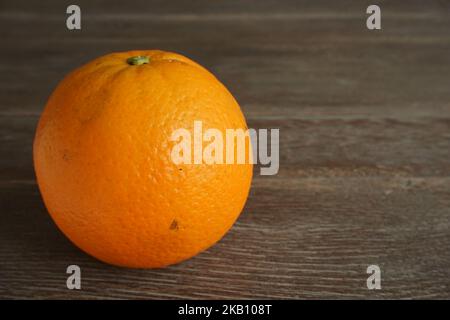 a oranges isolated on wooden table Stock Photo