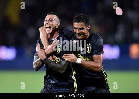 Turin, Italy - 26 June, 2020: Paulo Dybala (C) of Juventus FC celebrates  with Cristiano Ronaldo (R) and Federico Bernardeschi (L) of Juventus FC  after scoring a goal during the Serie A