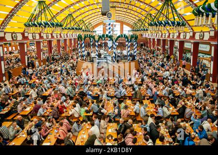September 24th, Munich. After a very busy weekend at the Oktoberfest grounds, the first Monday was a pleasant, relaxing day. Oktoberfest is the world's largest beer celebration and typically draws over six million visitors over its three-week run. Oktoberfest includes massive beer tents, each run by a different Bavarian brewer, as well as amusement rides and activities. (Photo by Romy Arroyo Fernandez/NurPhoto) Stock Photo