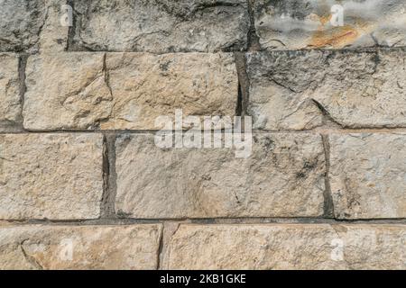 Close up view of a grunge stone brick wall in the city of Austin Texas Stock Photo