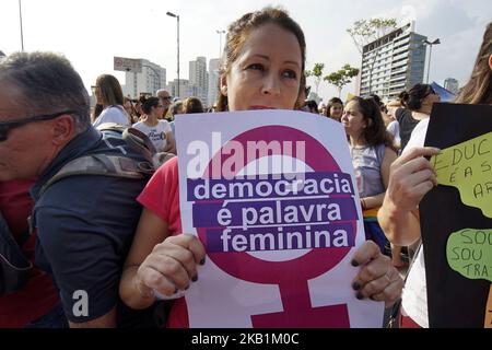 Women protest against the far-rights presidential candidate on September 29, 2018 in Sao Paulo, Brazil. The protests occurred simultaneously in several Brazilian cities, against Jair Bolsonaro, the far rights presidential candidate. Protests included an internet campaign (#elenão and #himnot) which was joined by many women from various countries. Corinthians fans, Brazil's biggest soccer team, and other social groups also joined. (Photo by Cris Faga/NurPhoto) Stock Photo