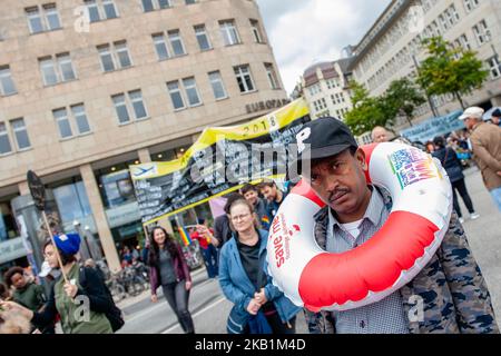 More than 400 initiatives call for a big demonstration under the slogan 'United Against Racism' on 29 September 2018 in Hamburg, Germany. 'We'll come united', is an open initiative of people from different social, antiracist and political networks, including refugees. They organized a massive demonstration against racism in Hamburg where around thirty thousand people from different countries gathered at the Rathausmarkt. Over 40 trucks from different organizations with their slogans against racism marched along the parade. After the demonstration, people gathered at the harbor, where several s Stock Photo