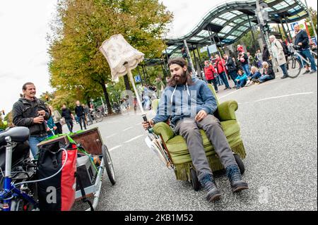 More than 400 initiatives call for a big demonstration under the slogan 'United Against Racism' on 29 September 2018 in Hamburg, Germany. 'We'll come united', is an open initiative of people from different social, antiracist and political networks, including refugees. They organized a massive demonstration against racism in Hamburg where around thirty thousand people from different countries gathered at the Rathausmarkt. Over 40 trucks from different organizations with their slogans against racism marched along the parade. After the demonstration, people gathered at the harbor, where several s Stock Photo