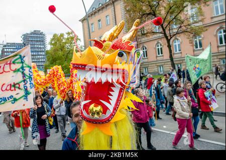 More than 400 initiatives call for a big demonstration under the slogan 'United Against Racism' on 29 September 2018 in Hamburg, Germany. 'We'll come united', is an open initiative of people from different social, antiracist and political networks, including refugees. They organized a massive demonstration against racism in Hamburg where around thirty thousand people from different countries gathered at the Rathausmarkt. Over 40 trucks from different organizations with their slogans against racism marched along the parade. After the demonstration, people gathered at the harbor, where several s Stock Photo