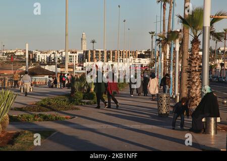 People walk along the Cornish in Casablanca, Morocco, Africa. The Cornish of Casablanca is a beautiful stretch along the Atlantic coast. The serpentine road has a parallel walkway for the pedestrians and there are a number of hotels, restaurants, and nightclubs located along the Cornish. (Photo by Creative Touch Imaging Ltd./NurPhoto) Stock Photo